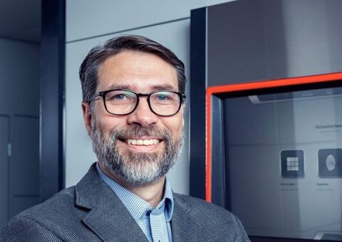 Vesa Hämetvaara Director, Business Development Konecranes Agilon staning in front of Agilon user access point